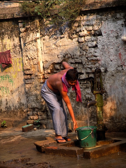Man getting water in Kolkata